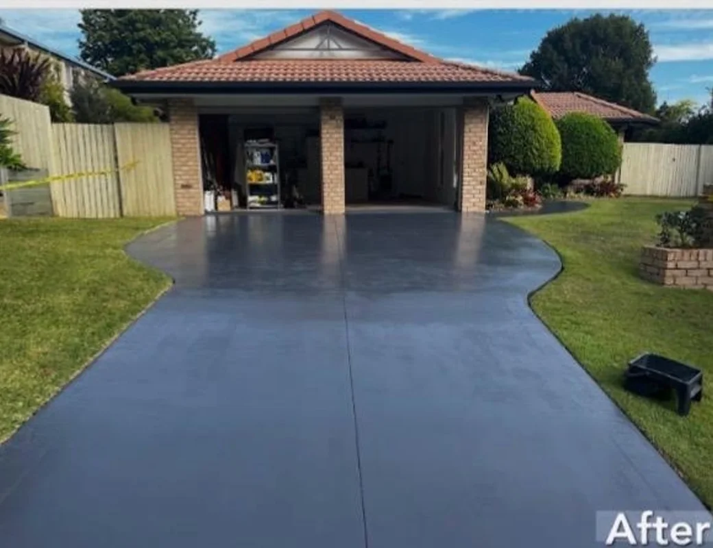 A Brisbane concrete driveway after resurfacing — a clean, renewed finish