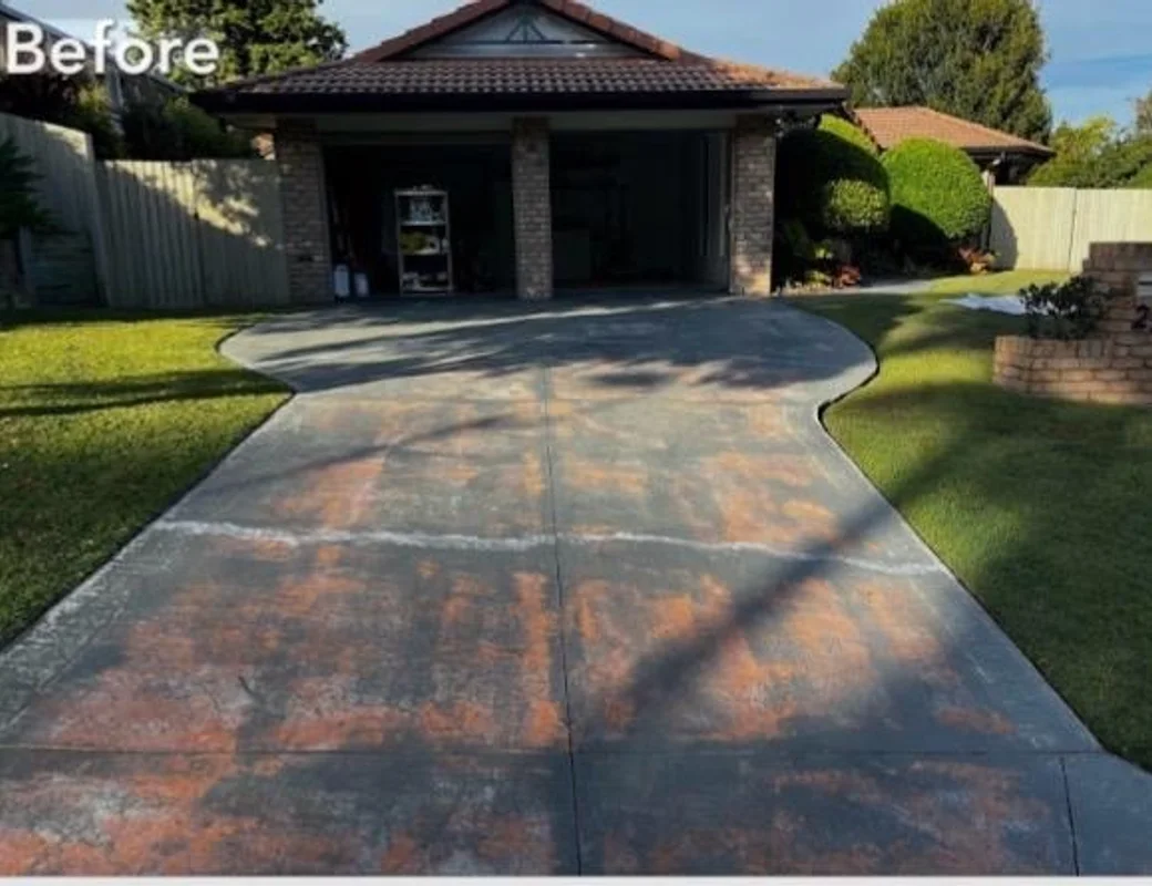 The same driveway before — worn, stained and dated concrete